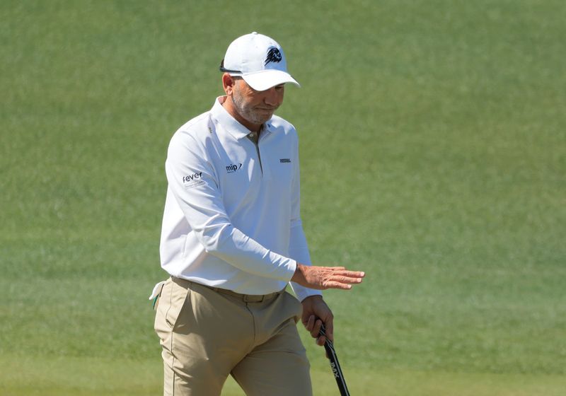 Former champion Sergio Garcia repeatedly struck the turf with his ⁠driver ‌before snapping the club when he hit a cooler beside the tee.