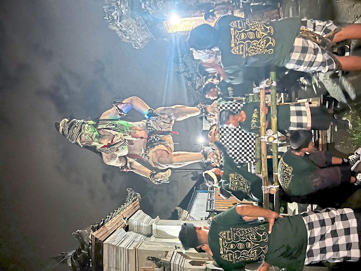 The writer and her family joined the hotel for a guided walk through a nearby village to participate in the ogoh-ogoh procession.