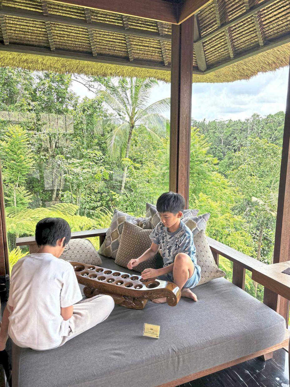 The writer’s children while away an hour or two in the resort library.