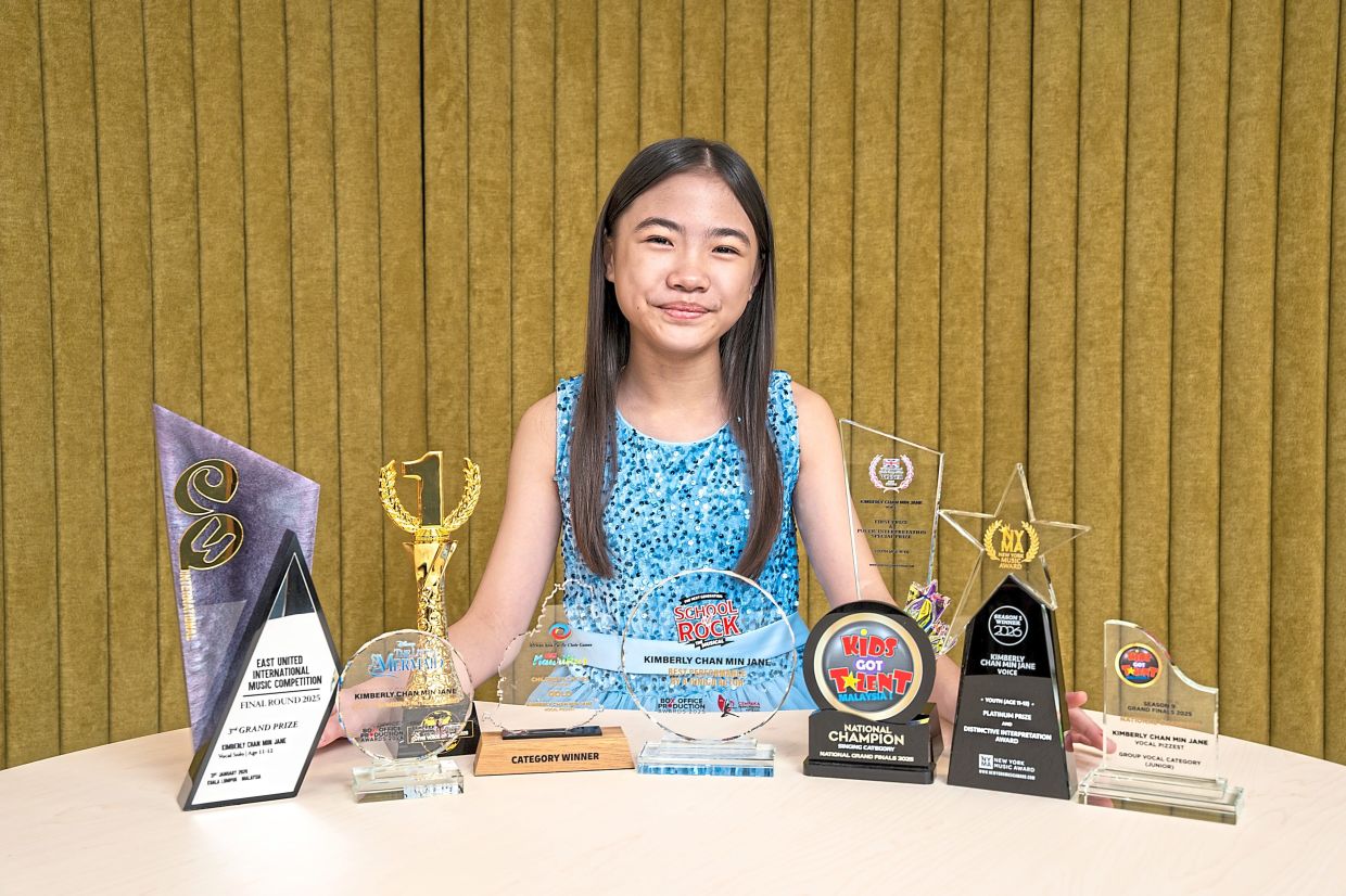 Kimberly with her collection of trophies, including some won this year.