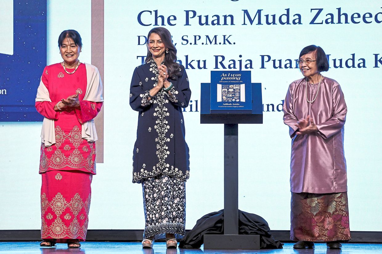 Raja Puan Muda of Kedah Che Puan Muda Zaheeda Mohamad Ariff (centre) launches the 'As I Was Passing' book at the Adibah Amin Tribute Night alongside Lay Hua (left) and Khalilah Fadzilah. Photo: Bernama