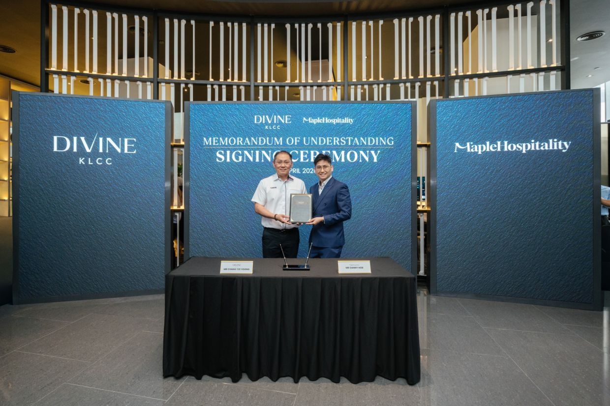 Chang (left) and Maple Hospitality founder Danny Ho signed a memorandum of understanding (MoU) during the launch of Divine KLCC.