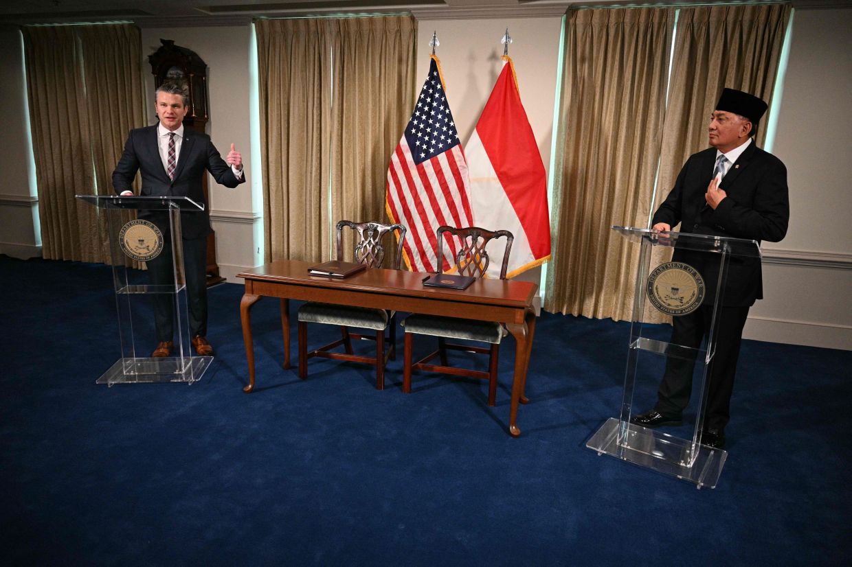 US Defence Secretary Pete Hegseth (left) and Indonesian Defence Minister Sjafrie Sjamsoeddin speak during a press conference at the Pentagon in Washington, DC, onMonday, April 13, 2026. -- Photo by Jim WATSON / AFP
