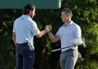 Golf-McIlroy holds nerve to defend Masters title, adds to his growing legacy