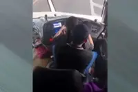 QuickCheck: Did an express bus driver let a woman sit on his lap while driving?