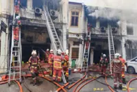 Rescue underway for trapped victim after fire engulfs law firm in George Town