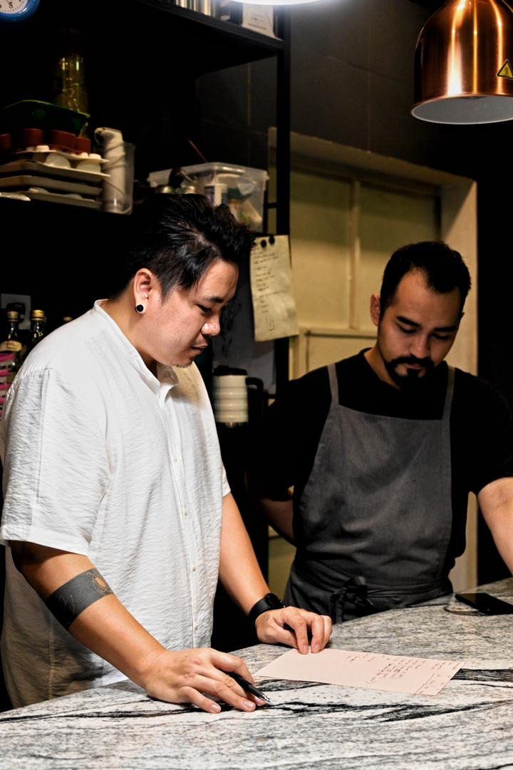 As a result of his traumatic experience in restaurant kitchens, Weldie (left) is now very laidback in terms of running his own kitchen. — Chipta11a