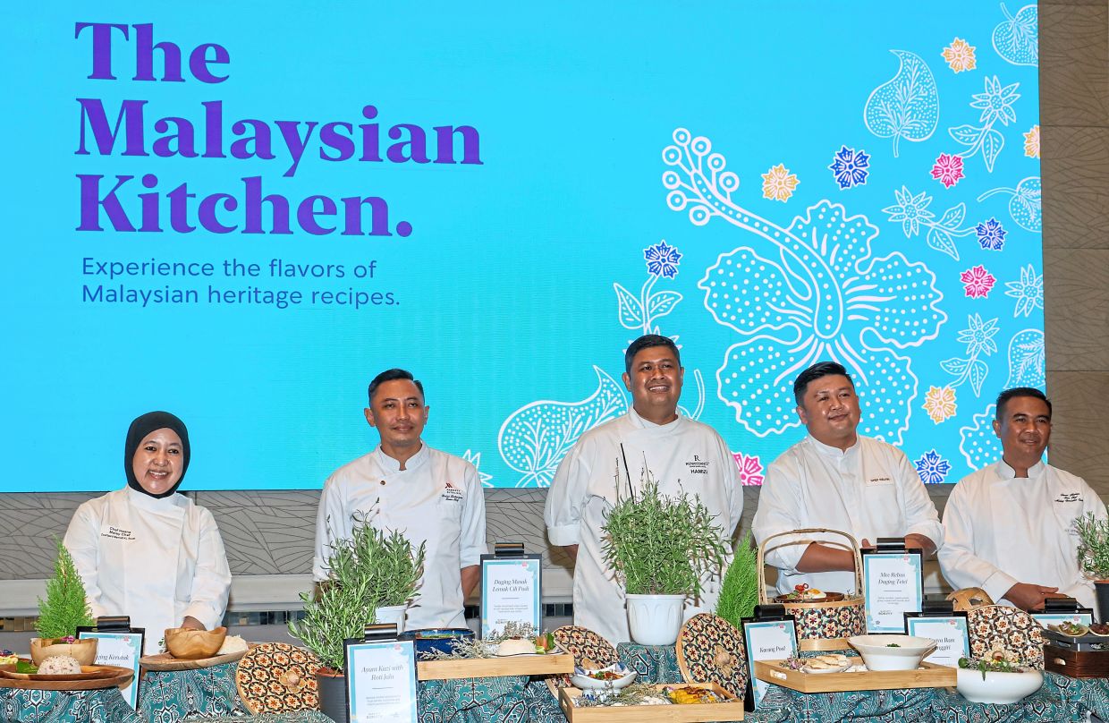 From left: Chefs Hasnaerdawaty, Mohd Hairi, Hamizi, Kelvin and Mohd Fauzi with their special dishes at The Malaysian Kitchen 2026 launch at The St. Regis Kuala Lumpur.