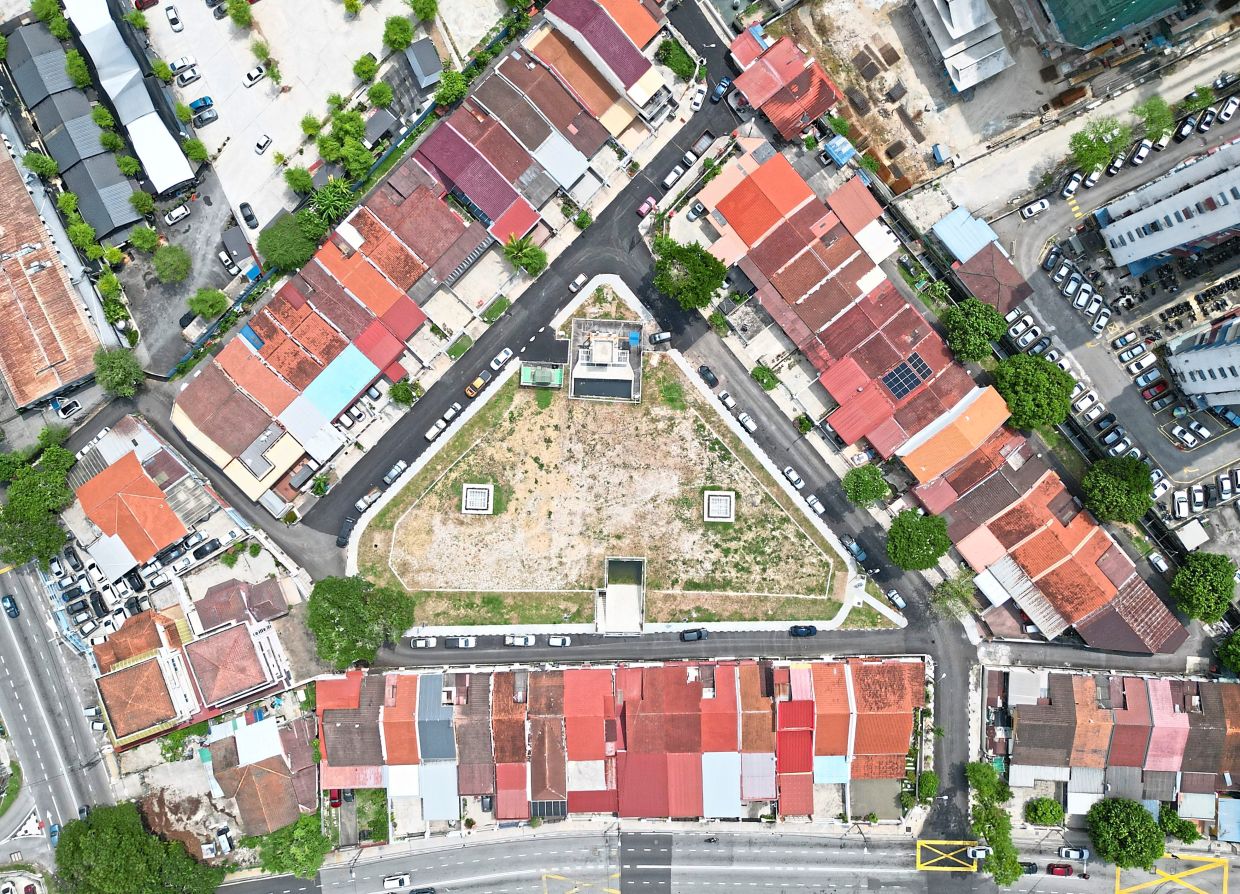 A field surrounded by one-storey homes now hides an underground flood retention system capable of holding more than 5,000 cubic metres of stormwater, enough to fill 250 water tanker lorries.