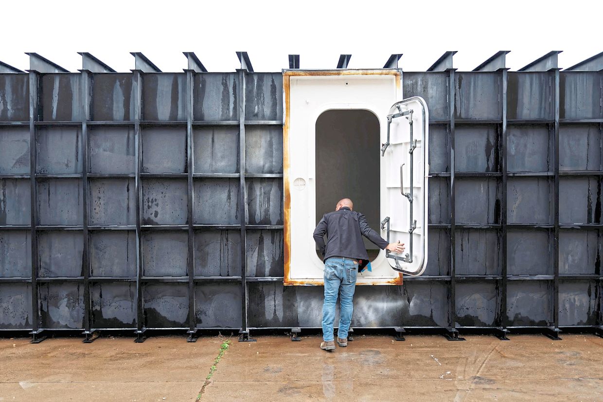 Shop manager Davis Yarber opening up a survival shelter door at the Atlas Survival Shelters factory in Sulphur Springs, Texas. Since the conflict in the Middle East began nearly two weeks ago, the demand for bunkers and bomb shelters is at an all-time high. Foreign and US clients are rushing to buy them, hoping to be able to seek refuge ‘in case of air raids, nuclear fallout or apocalypse’. — AFP