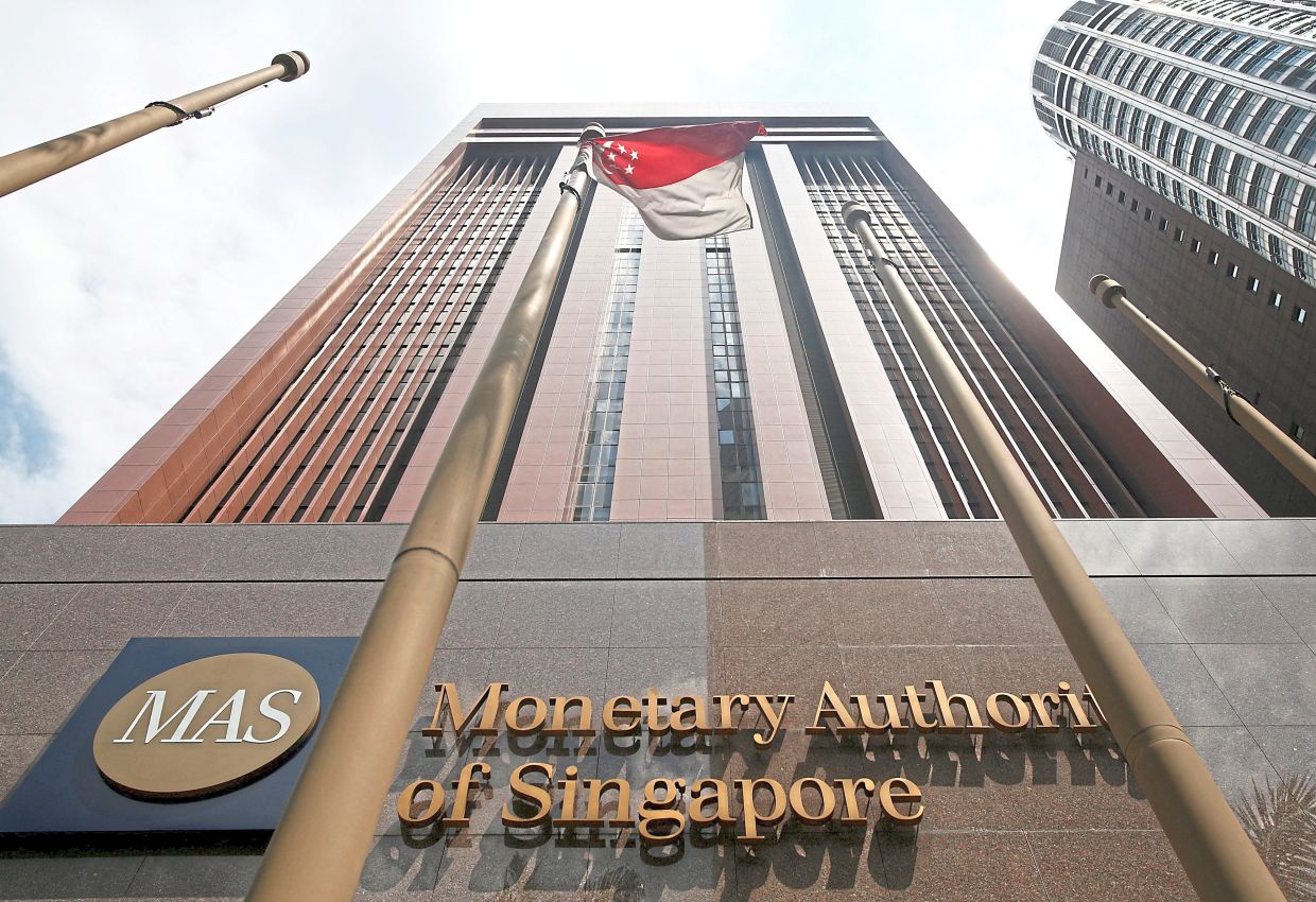 Singapore's central bank tightened its monetary policy settings on Tuesday, flagging the risk that an Iran war-fuelled energy shock could push up core inflation even as mounting pressure on growth was underscored by a first-quarter economic contraction.