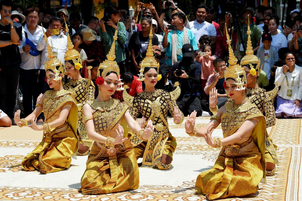 Dancers perform during Khmer New Year (Nokor Sankranta) celebrations at Wat Phnom in Phnom Penh on Tuesday,April 14, 2026. -- Photo by TANG CHHIN Sothy / AFP