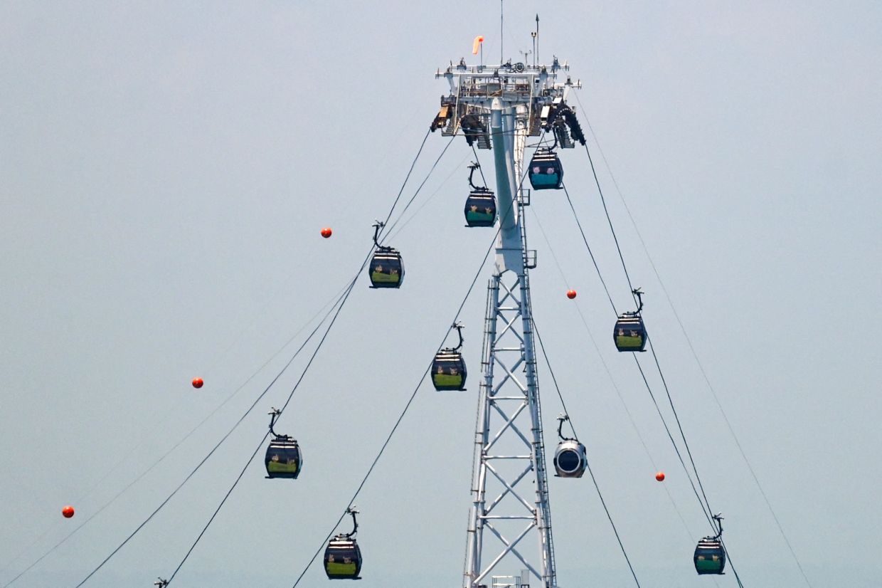 Cable cars are pictured at Sentosa resort island in Singapore on Tuesday, April 14, 2026. -- Photo by Roslan RAHMAN / AFP