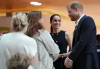 Prince Harry and Meghan arrive in Australia to a muted welcome