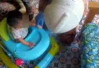 Baby rescued after getting thumb stuck in walker