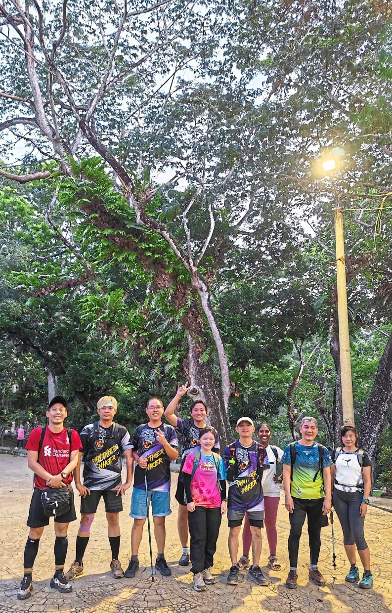 (From left) Liew and Lim with several friends at Penang City Park beforehiking up Astro Rock.