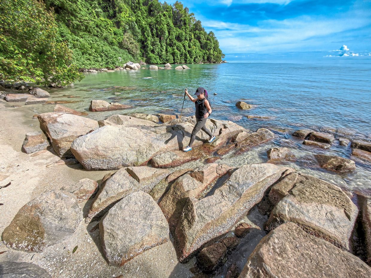 Hiking in Penang is not limited to the hills, as one can venture to the sea, says Tang, seen here during her recent hike to Monkey Beach behind Penang National Park in Teluk Bahang.