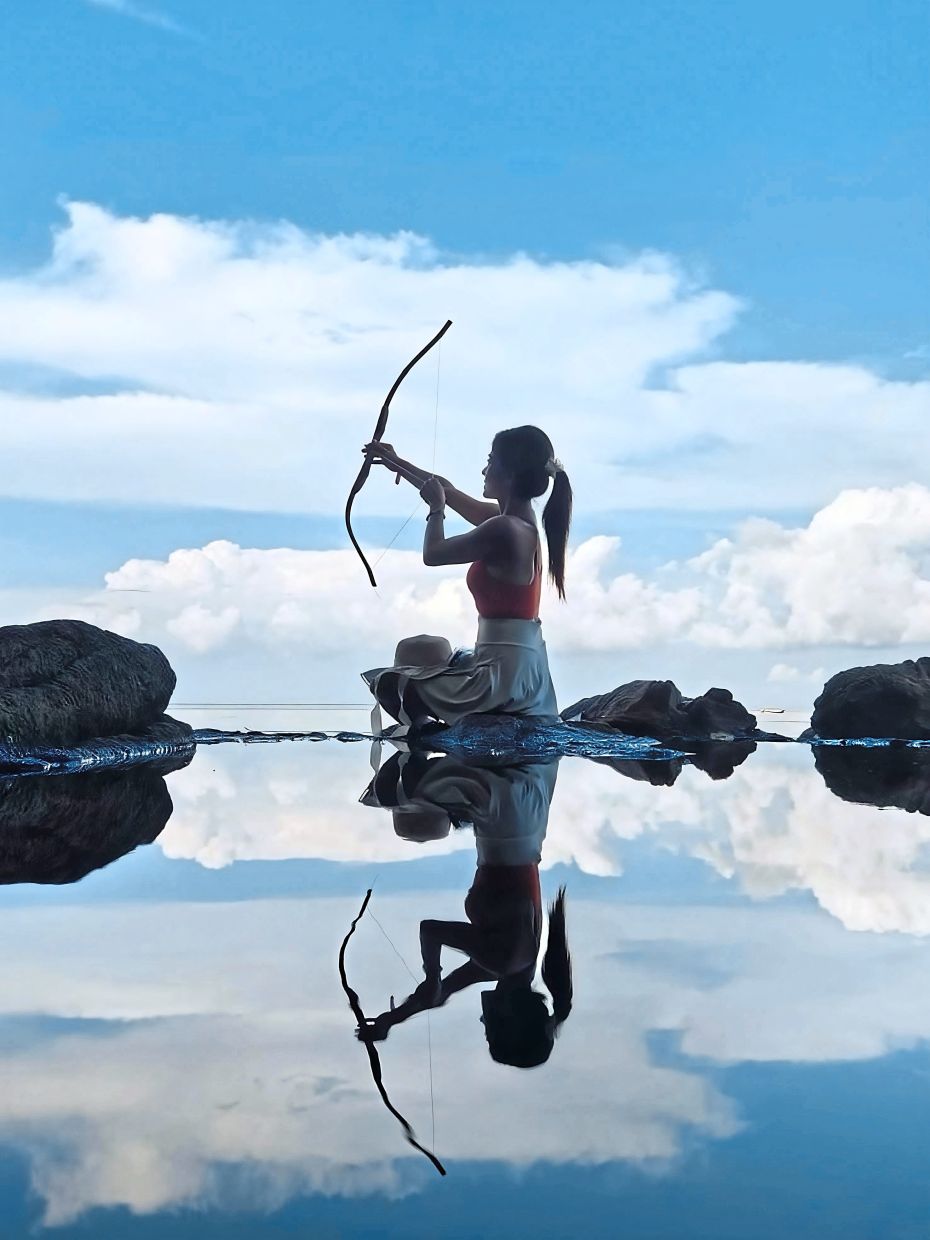 Jincy Lee enjoying the scenic swing at Port Scam.