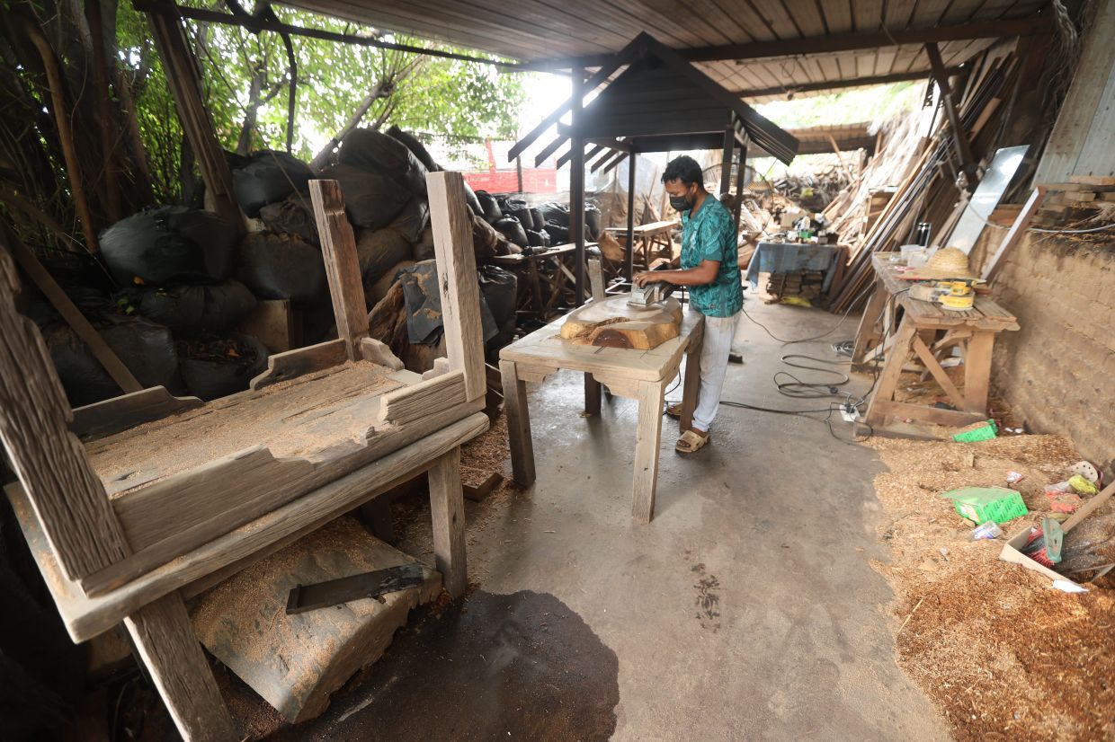Staff at an outdoor furniture shop still working to fulfil existing orders from customers.