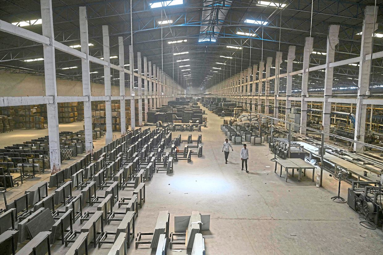 Workers seen at a ceramics factory that remains closed amid propane gas supply constraints and global energy crisis owing to the Middle East conflict, in Morbi, India. — AFP 