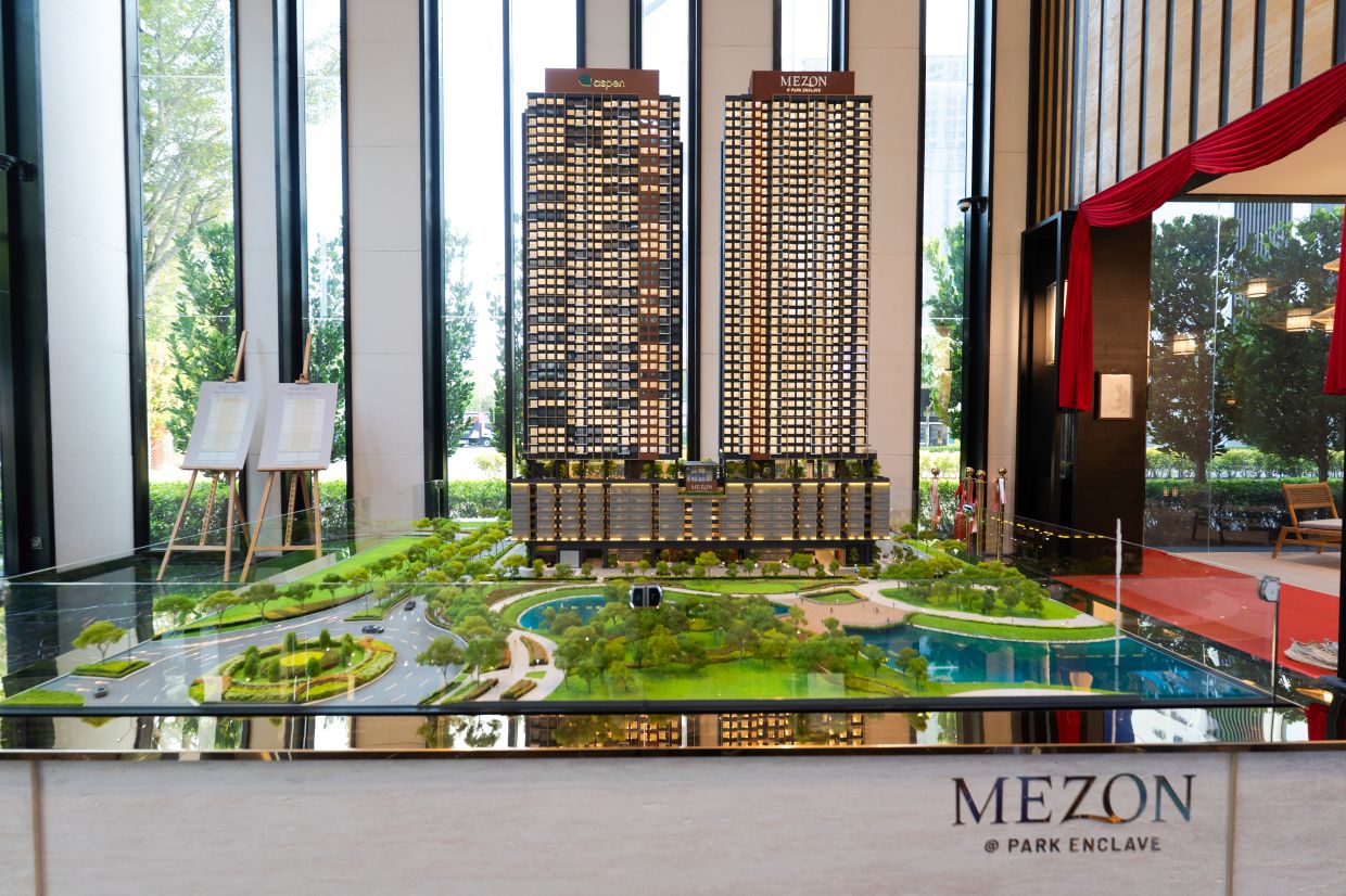 The development comprises two 47-storey towers, with 301 units per tower.