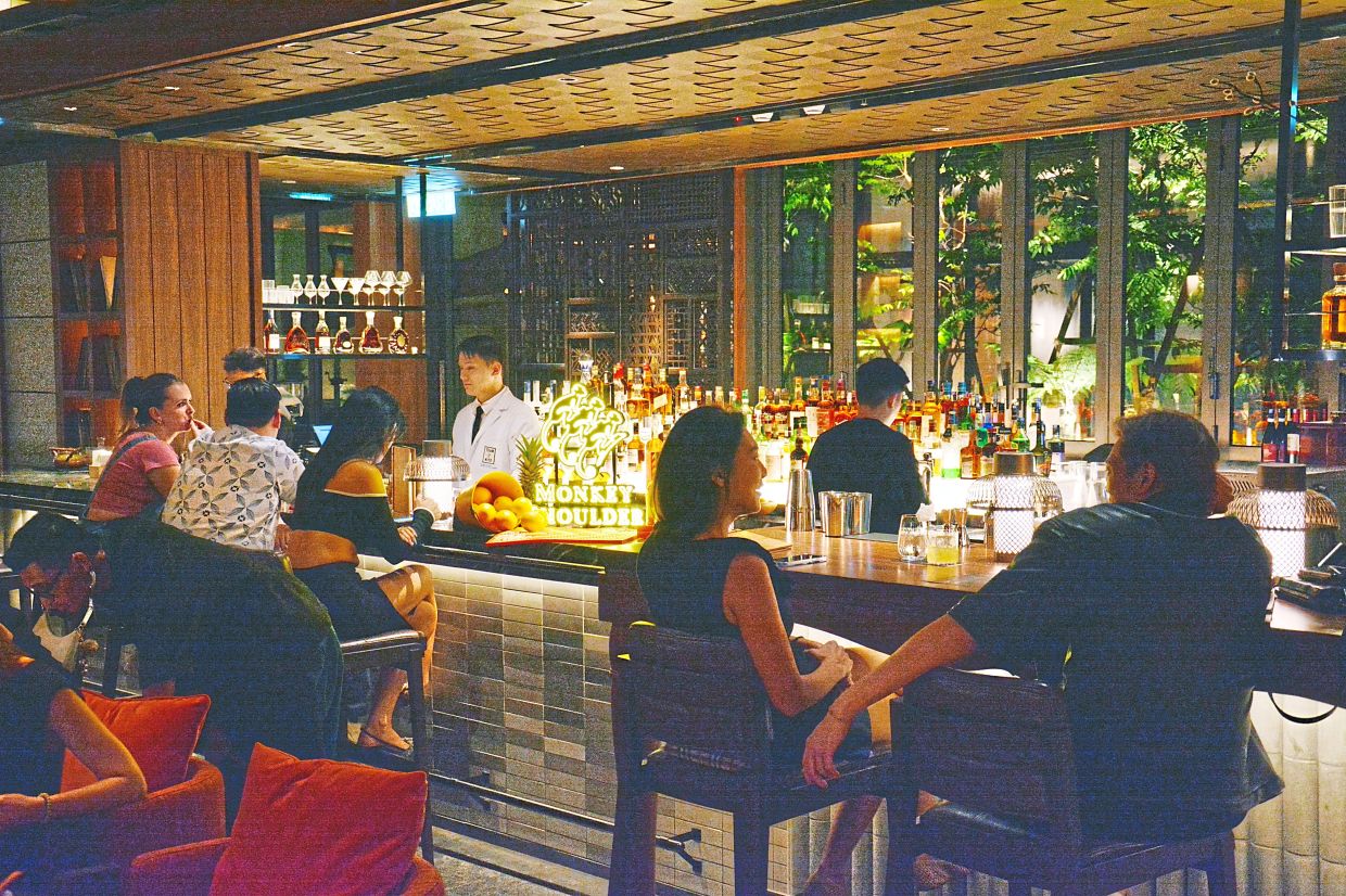 Enso features a long cocktail bar and a lively open kitchen. 