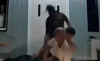 A man is seen being held and pummelled by several others in a video that went viral on social media recently.