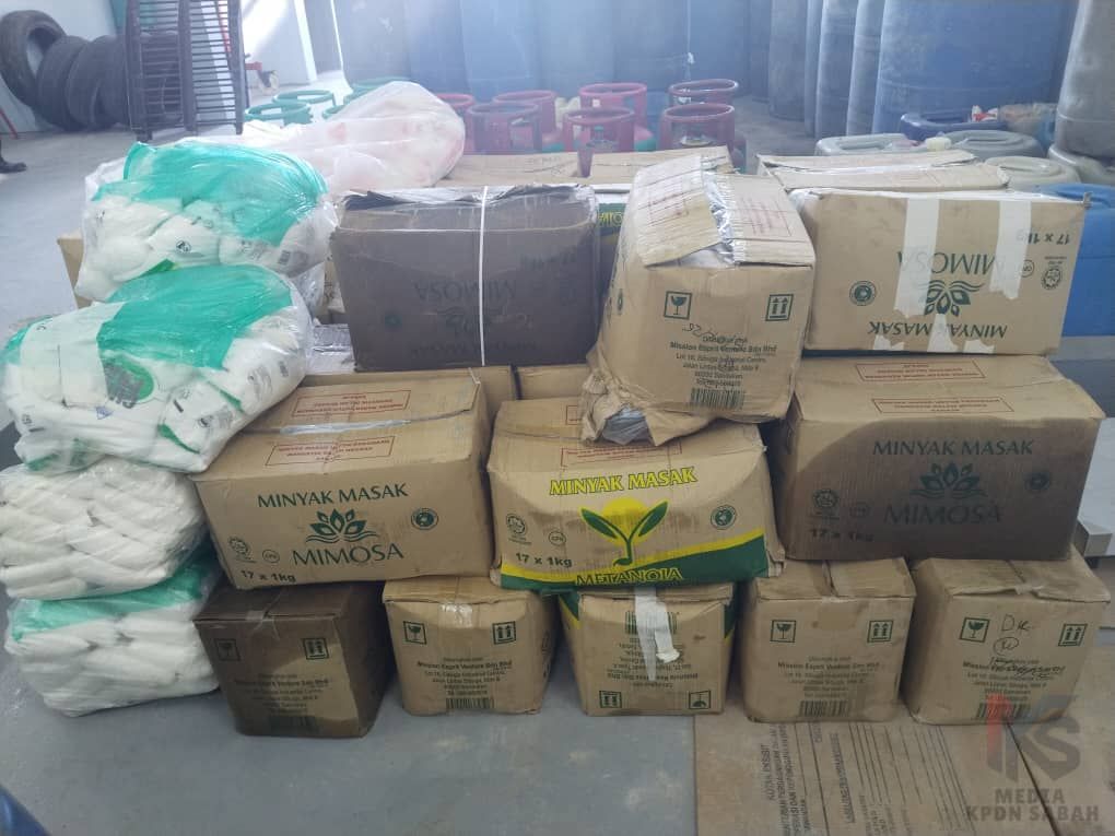 Some of the goods including cooking oil seized from a local man involved in smuggling in Sabah's northern Kudat district.