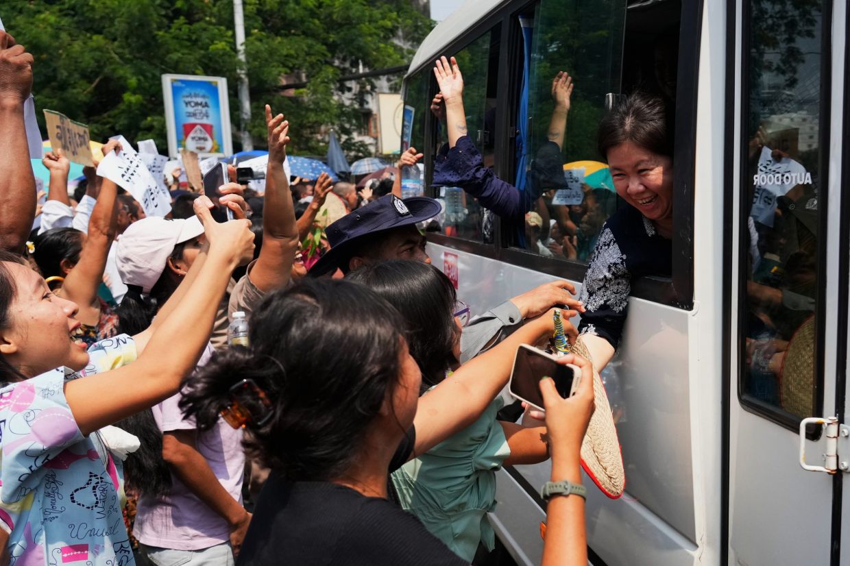Released prisoners, in a bus, are welcomed by family members and colleagues after they left Insein Prison in Yangon, Myanmar, on Friday, April 17, 2026, following the Myanmar President's amnesty to mark the country's traditional new year. -- AP Photo/Thein Zaw