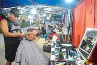 Dapper cuts for rural folk, thanks to ‘tent’ barber