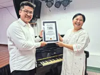 Music teacher simplifies Braille music notes, enters Malaysia Book of Records