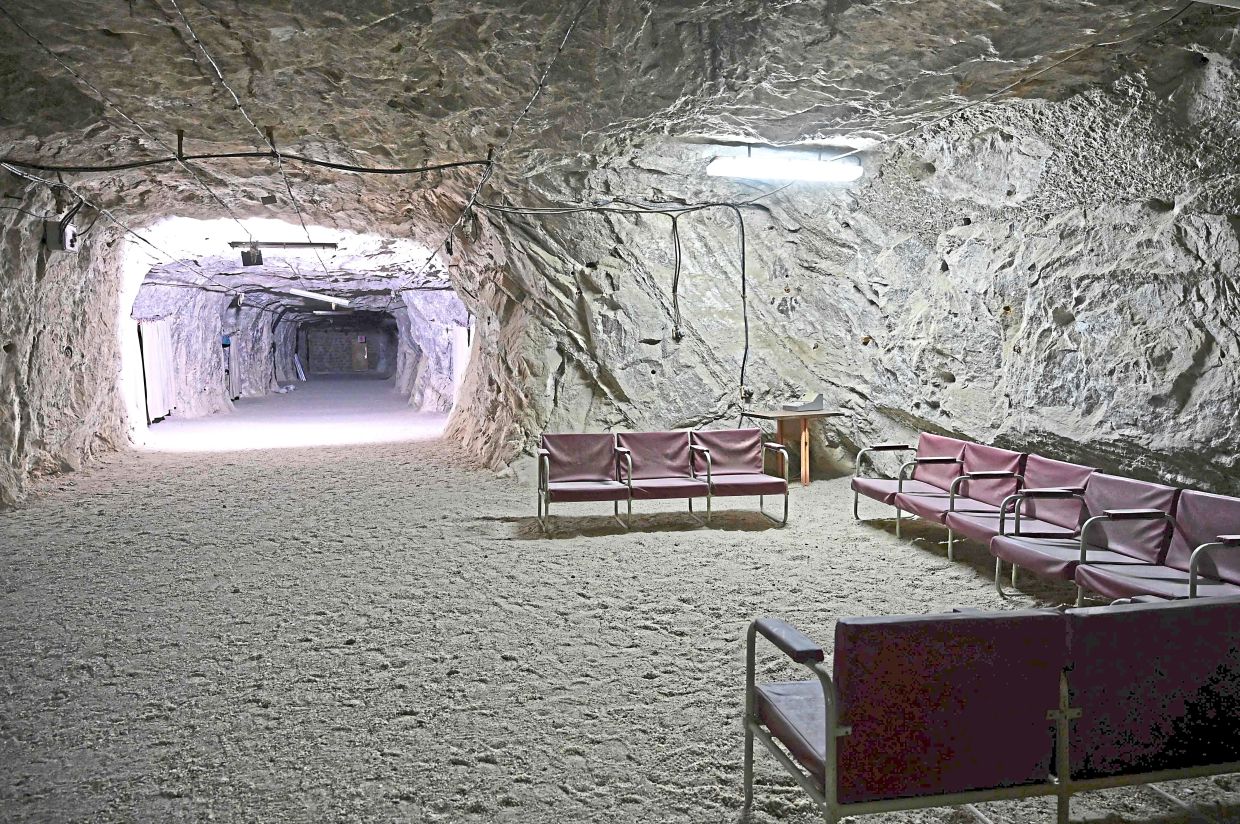 Various photos showing the interior of the Republican Centre of Speleotherapy including a seating area, a dining room and a patient’s bedroom. — AFP