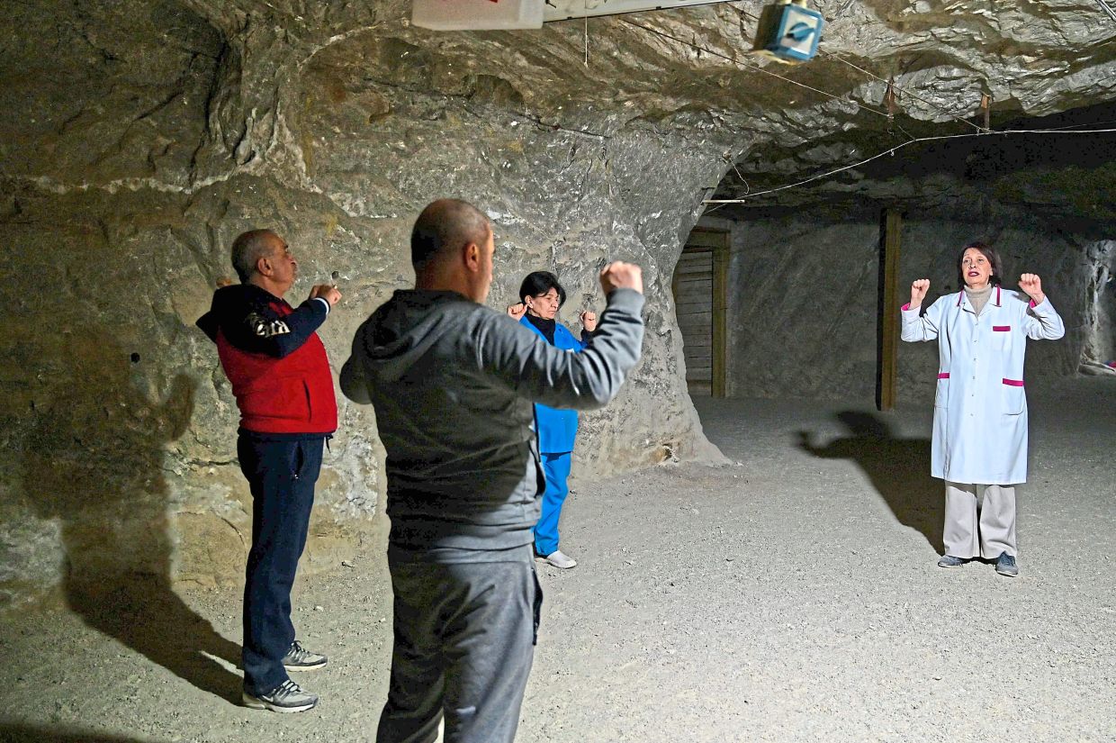 Voskanyan (right) leading an exercise for patients of the Republican Centre of Speleotherapy on the outskirts of Yerevan. — AFP