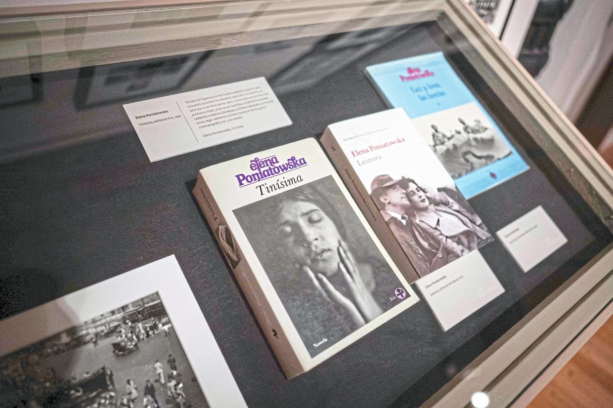 Books written by Poniatowska are displayed during the inauguration of her exhibition at the Estanquillo museum in Mexico City on April 16. Photo: AFP 