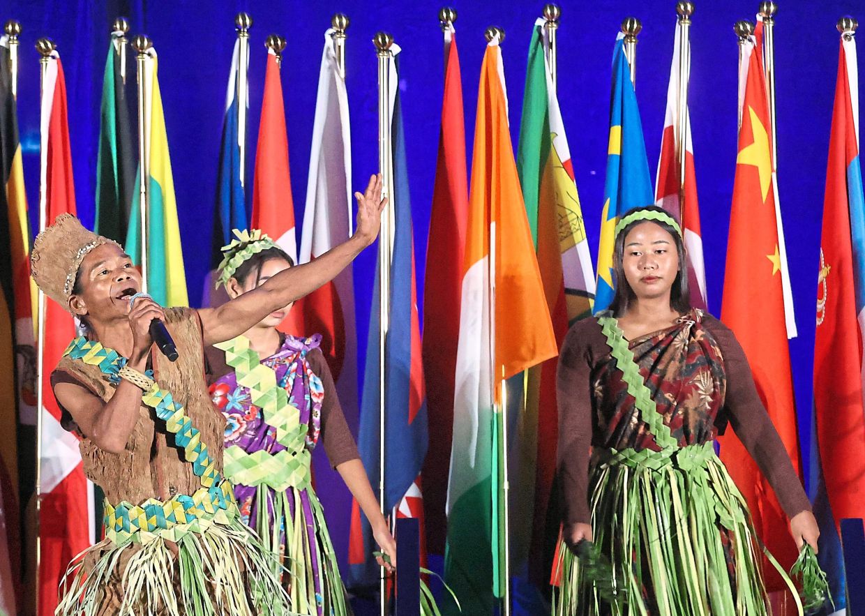 A Temuan musical group performing at the welcoming ceremony.
