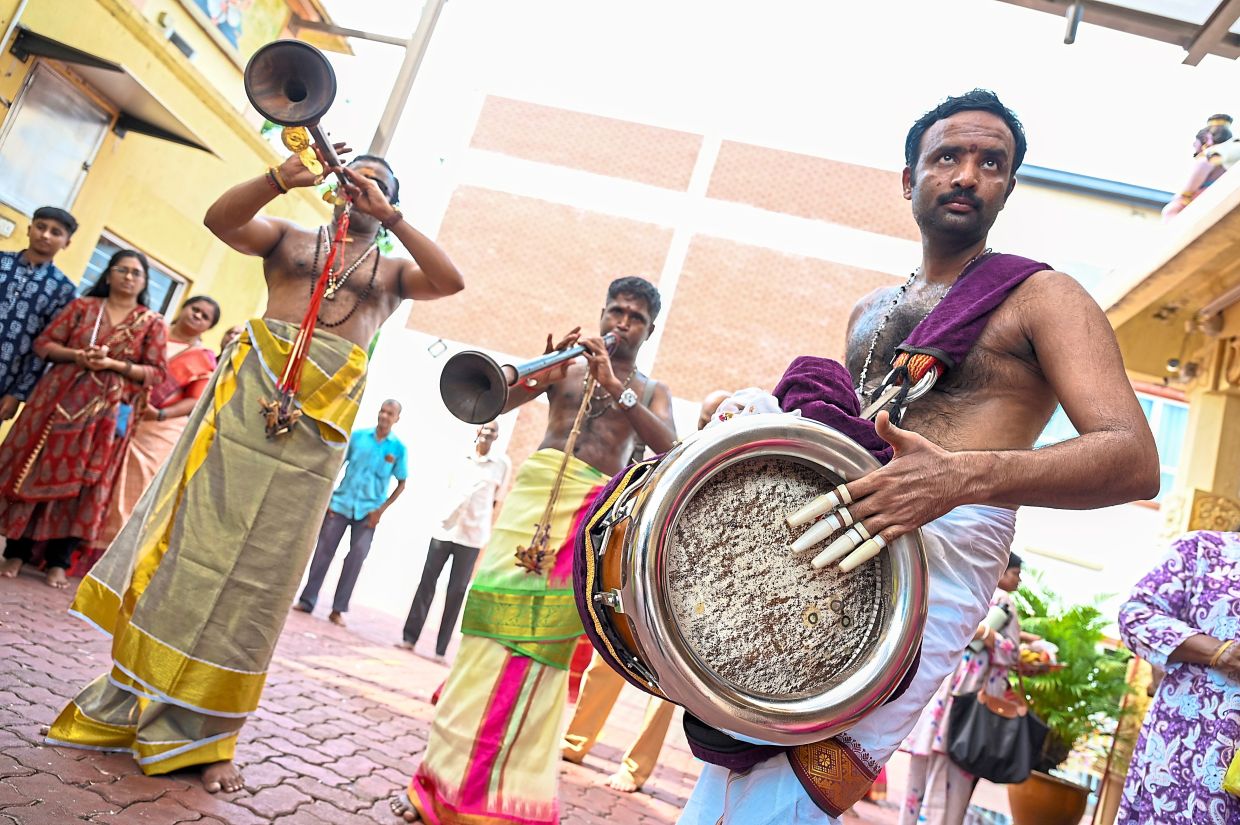 Devotees fill the air with lively sounds of traditional music.