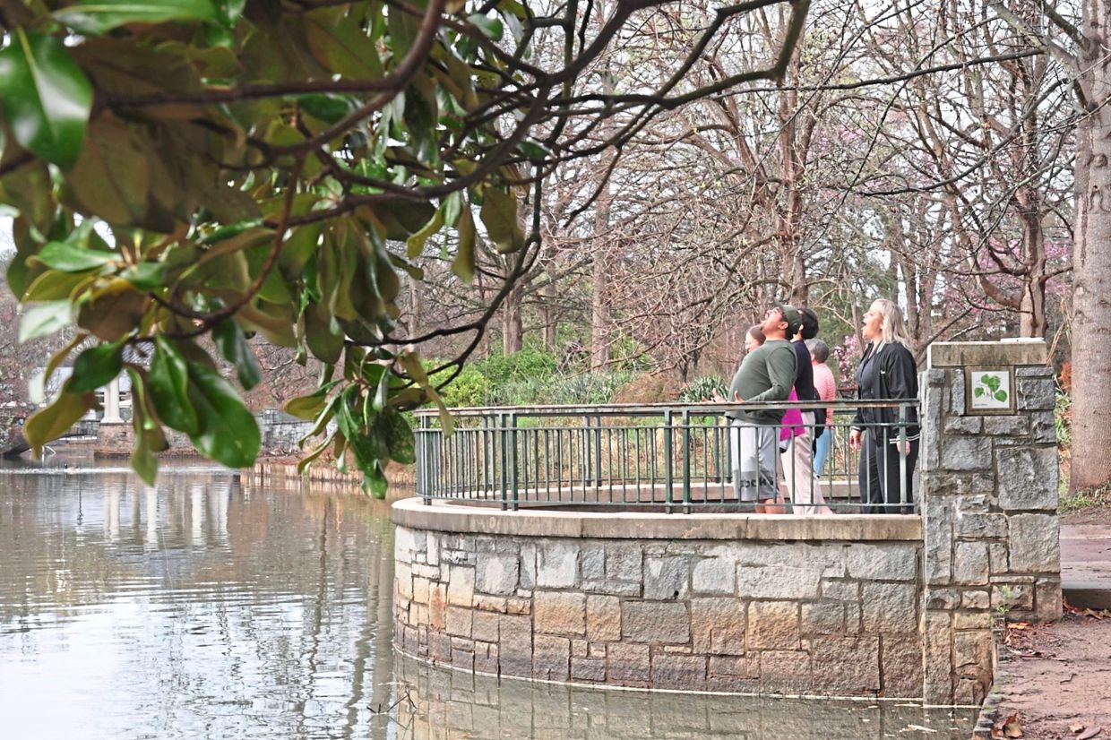 Scream Club participants screaming together at Piedmont Park in Atlanta, Georgia. — AP