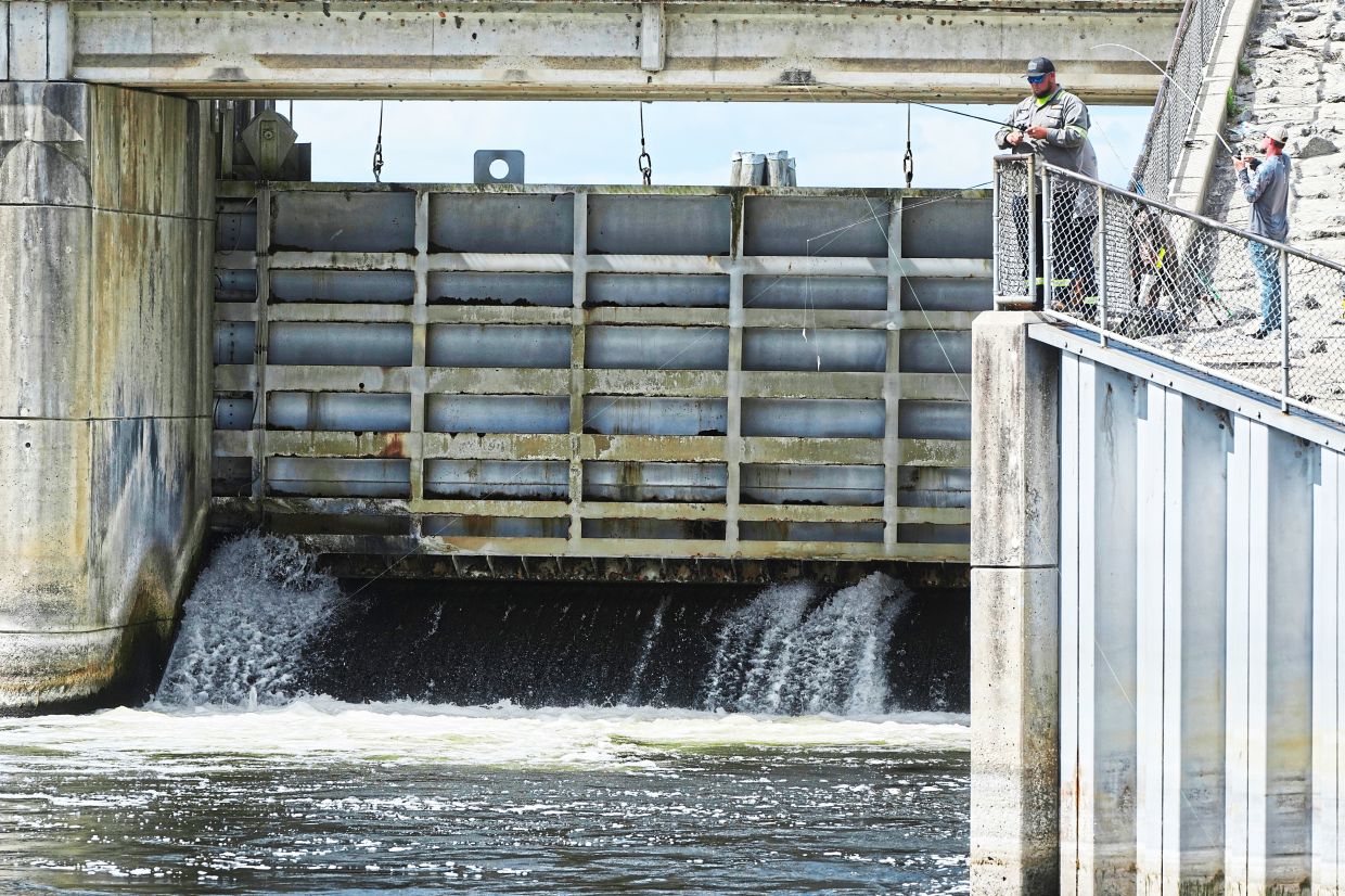 Fishermen throw their lines into the Kirkpatrick Dam spillway in Palatka, Florida.