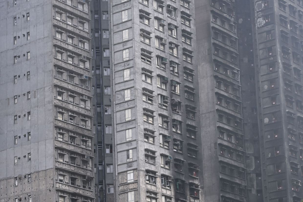A view of the towers of Wang Fuk Court residential estate in Hong Kong on April 20, 2026. - AFP