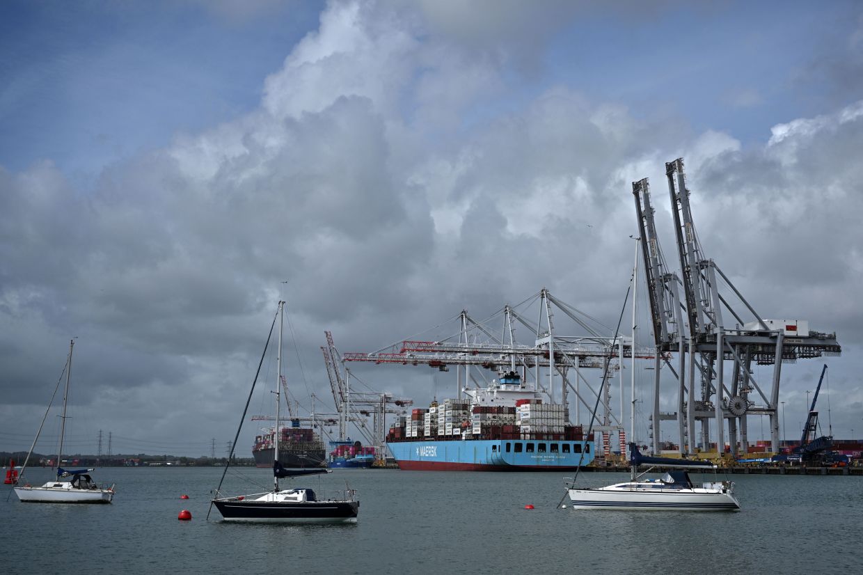 The Maersk Monte Olivia container ship, registered under the flag of Singapore, is seen docked at the container terminal of Southampton Docks in Southampton on the south coast of England. -- Photo by Ben STANSALL / AFP