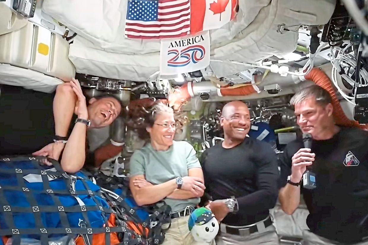 (From left) Wiseman, Koch, Glover and Hansen take questions during a video conference with media following their historic mission. — Nasa/AP