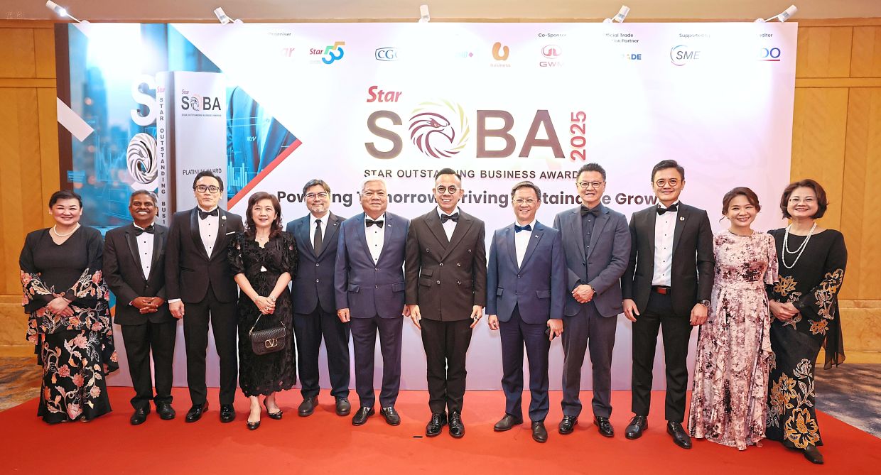 (From left) SMG chief content officer Datin Paduka Esther Ng, Jai Shankar, Rizal, Ting, Mohamed Nazri, Wong, Sim, Chan, Tio, How, Lim and Wang at the event’s photo wall.