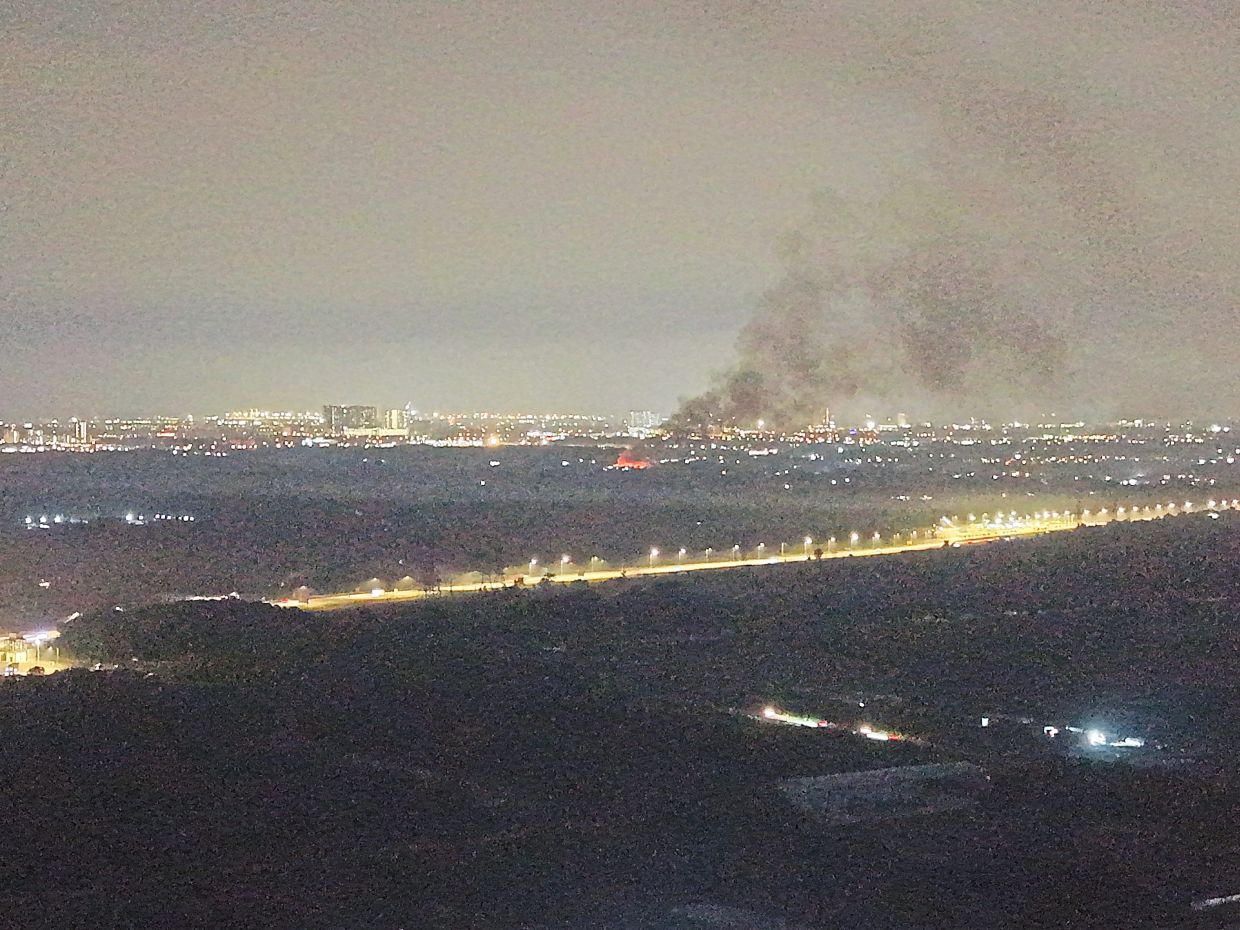 An aerial survey by residents spotted a large fire originating from a suspected dumpsite near Bandar Tropicana Aman.