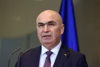 Romanian PM says he'll lead minority government after leftist Social Democrats walk out