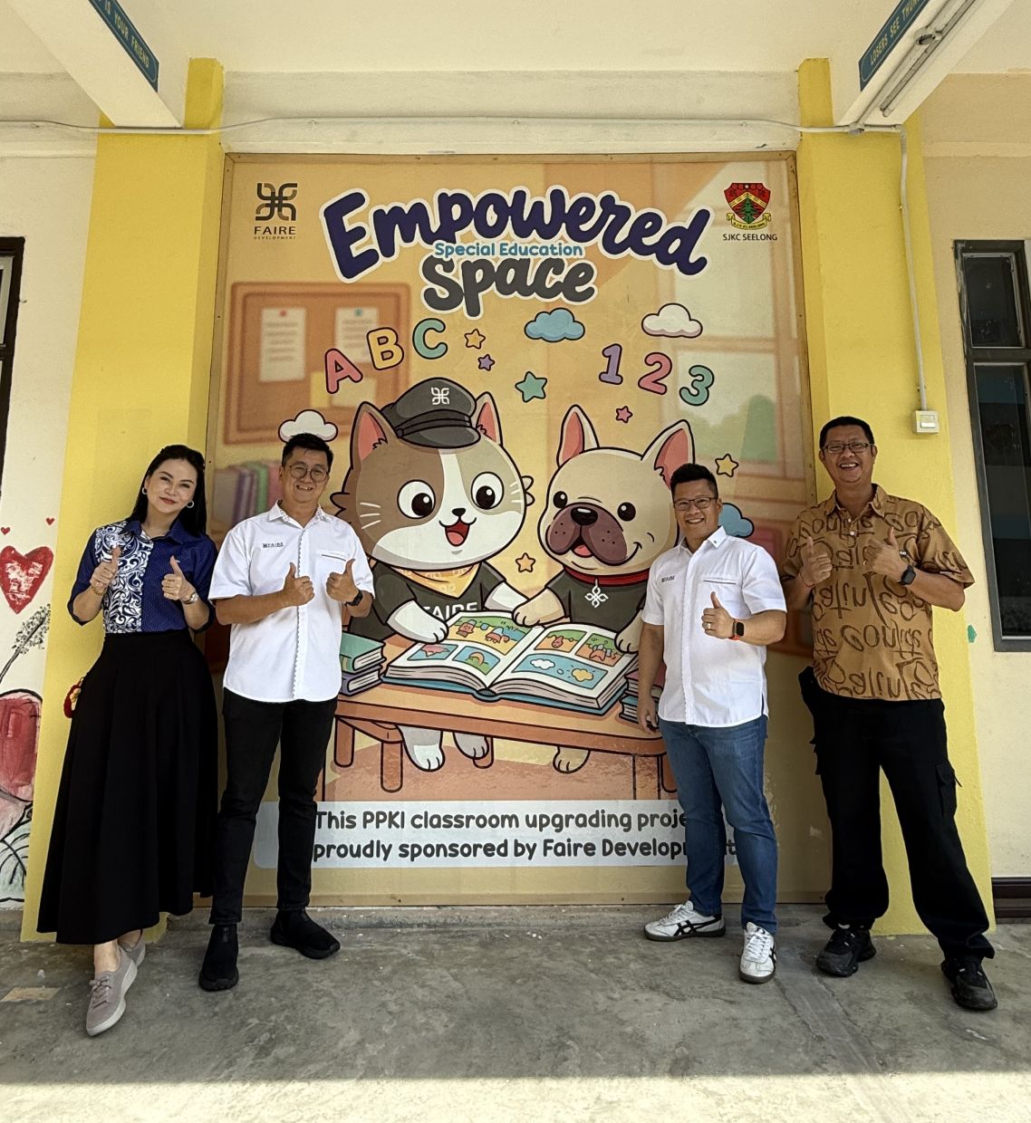 (From left) Ling, Woon, Lim and Koh posing for a group photo after the successful completion of the PPKI classroom expansion project at SJK(C) Seelong.