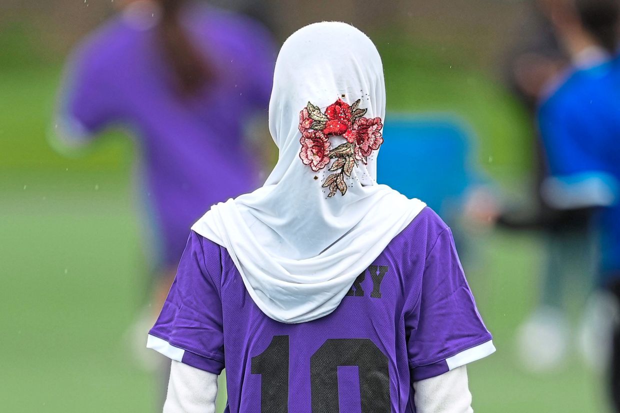 Suraya Abdull playing in a soccer tournament for immigrant and refugee girls.