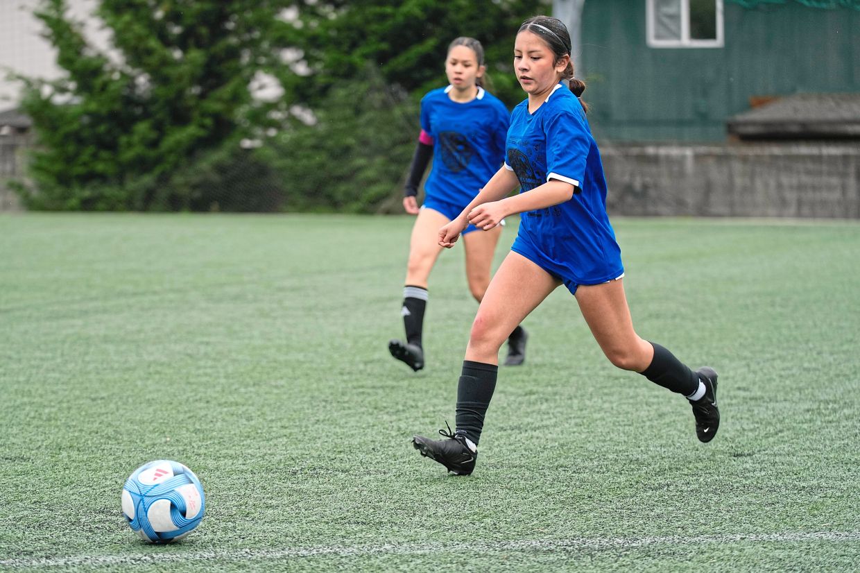 Valeria (right) in action during a soccer tournament.