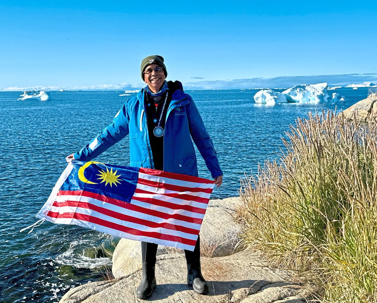 With the Malaysian flag at the inaugural Arctic Circle Marathon, 2024. Photos: Dr APPASAMY VELU