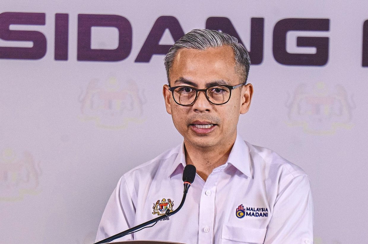 Policy gains: Fahmi speaking at the weekly Cabinet press conference at the Communications Ministry headquarters in Putrajaya. — Bernama