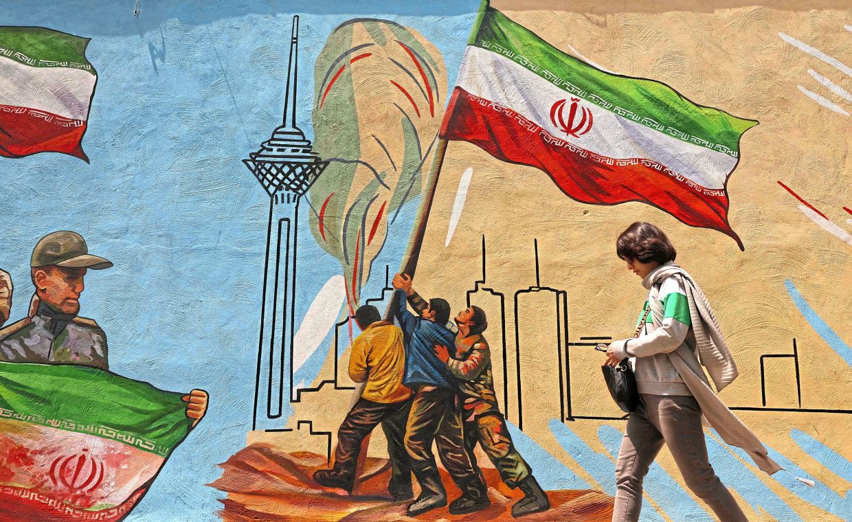 Murals and banners have long defined Iran’s urban landscape, especially in Tehran, where central works reflect state political messaging and foreign policy. Photo: AFP 